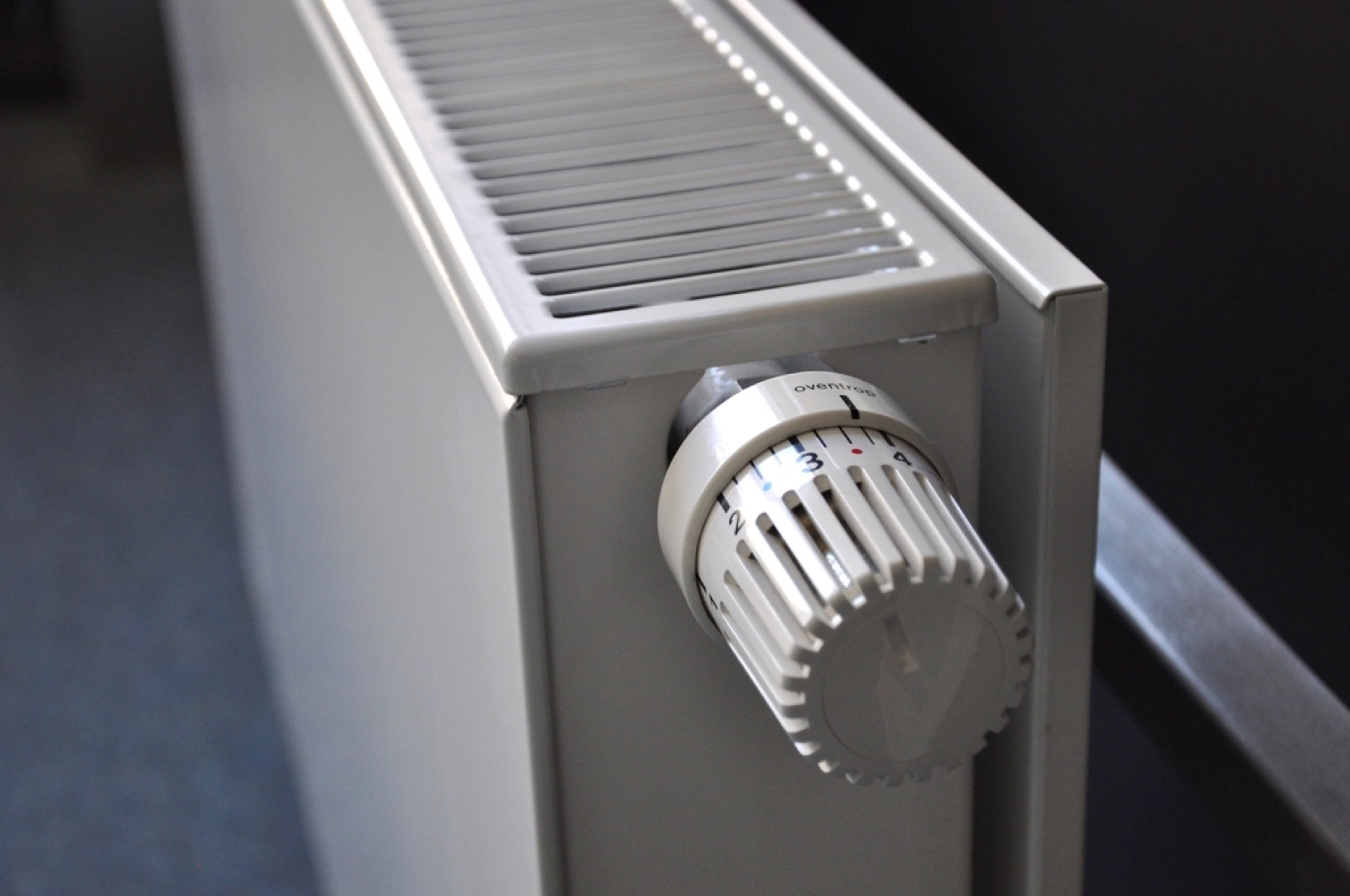 A thermostatic valve on a white radiator